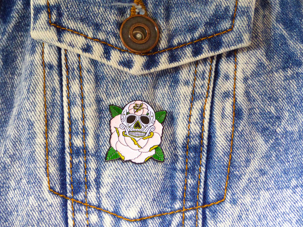 LIFE IS ROSY Sugar Skull Tattoo Soft Enamel Pin on a denim jacket