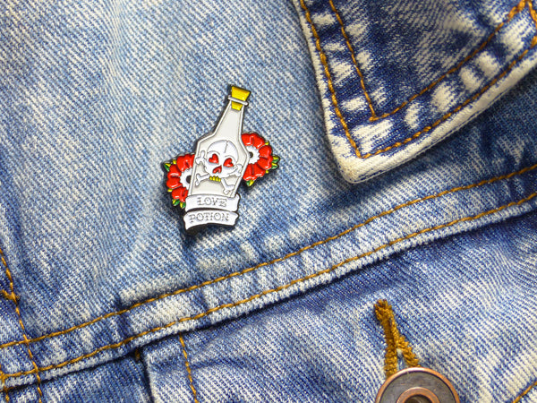 Love Potion & Skull Tattoo Soft Enamel Pin pinned on Denim Jacket