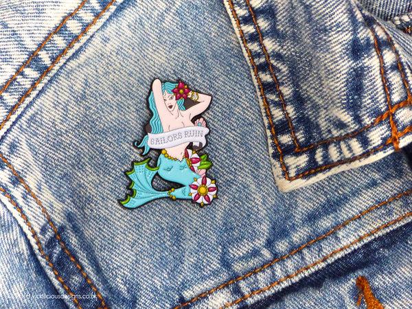 SAILORS RUIN Mermaid Pinup Girl Tattoo Soft Enamel Pin pinned on denim jacket